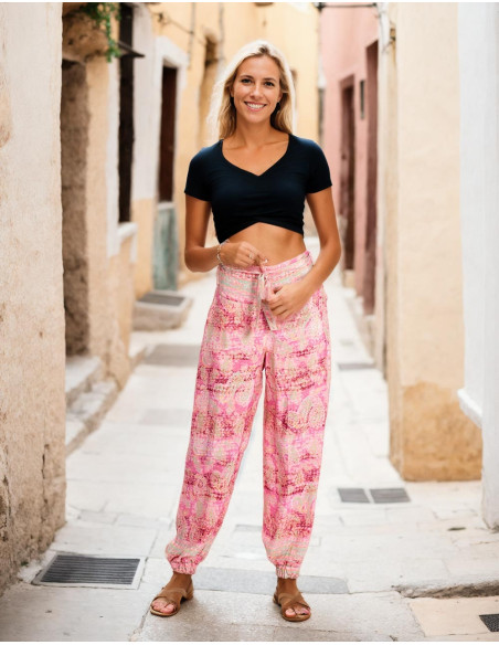 Pantaloni in seta stampata nei toni del rosa